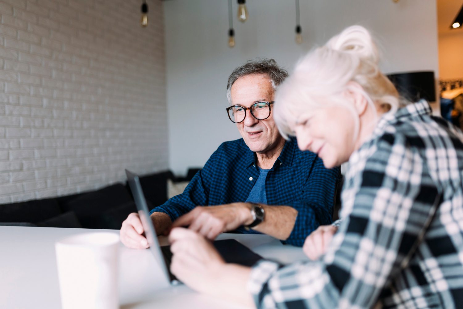 older-couple-retirement-home-with-laptop